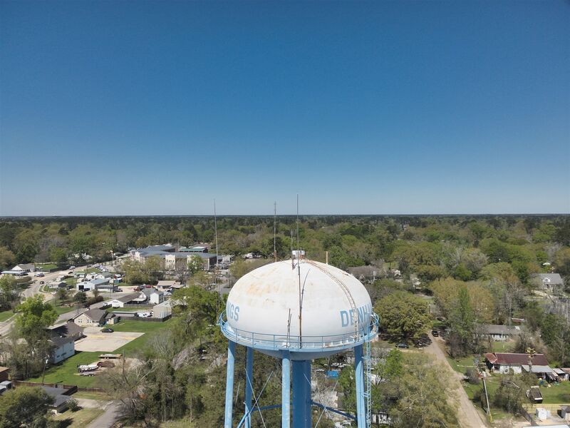 The old Denham Springs water tower above the Antique Village and downtown