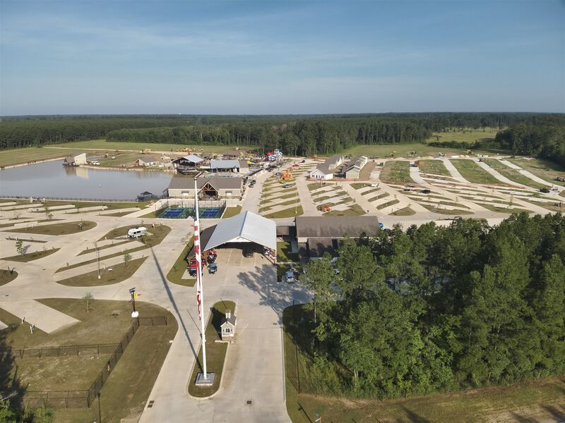 Aerial overview of the Patriots RV resort, pond and lodge